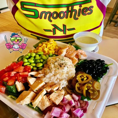 Loaded protein bowl with grilled chicken, shrimp, rice, corn, edamame, tomatoes, black beans, pickled onions and jalapeños
